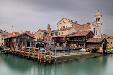 Venice Italy canals and gondola cityscape. Historic architecture and waterfront reflections create an iconic European travel destination. © Chris Chambers
