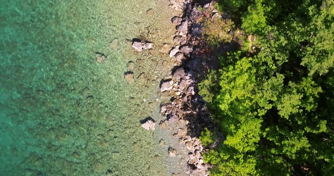 Aerial Top-Down View of the Rocky Adriatic Coast and Forest on Krk Island, Croatia