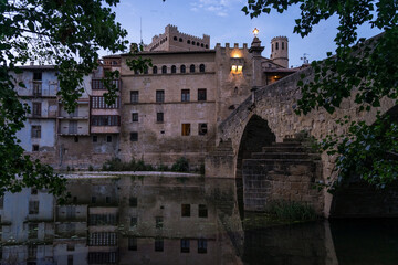 Fototapeta premium VALDERROBRES, SPAIN - JULY 02, 2025: Panoramic view of the beautiful village of Valderrobres, in the Matarraña zone, at night. Teruel, Aragon, Spain.