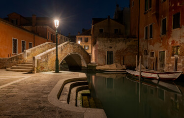 Venice Italy canals and gondola cityscape. Historic architecture and waterfront reflections create an iconic European travel destination. © Chris Chambers
