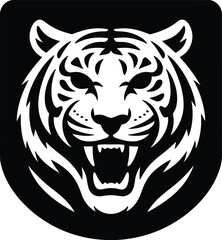 Fototapeta premium Fierce tiger head silhouette bold black and white of a roaring big cat face, aggressive predator portrait with sharp teeth and striped patterns, isolated on a white background
