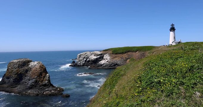 Scenic view of waves crashing at Yaquina Head Lighthouse in Oregon