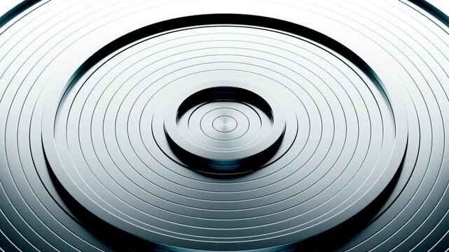 Rippling concentric circles expanding and contracting in water