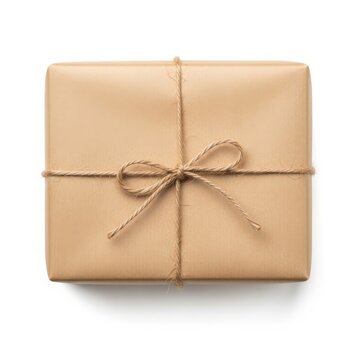 Gift package wrapped in brown paper, tied with simple jute twine bow