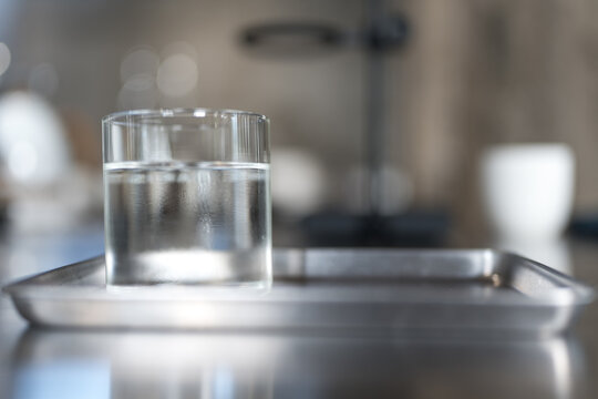 Refreshing Glass of Cool Water Served on Silver Tray at Cafe