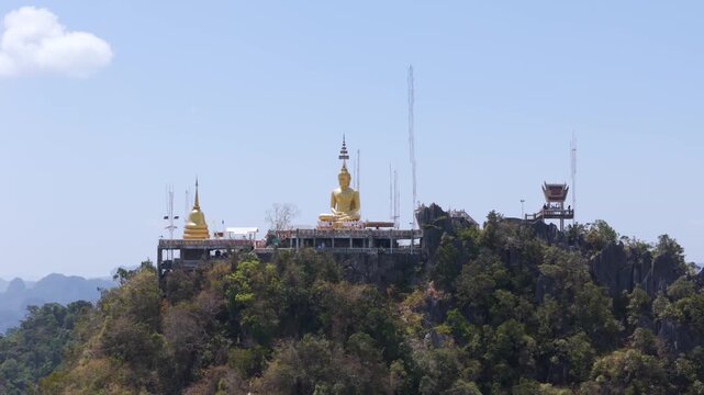 Gulden Buddha on mountaintop in Krabi, Tiger cave temple