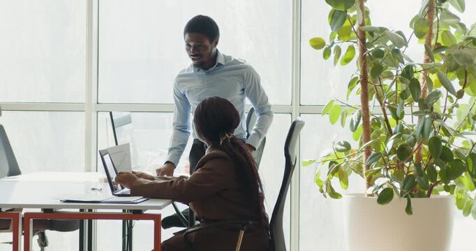 Mentorship in bright office. Supportive coaching amid peaceful setting