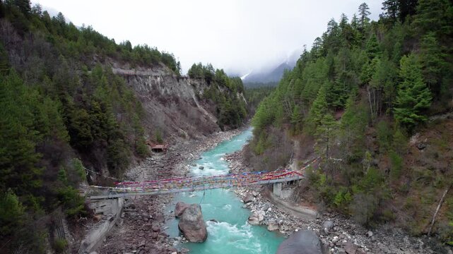 Drone view Parlung Zangbo river running along G318 or China National Highway 318 between Bomi and Baxoi County, Tibet, China, beautiful turquoise water in valley, 4k real time footage travel concept.