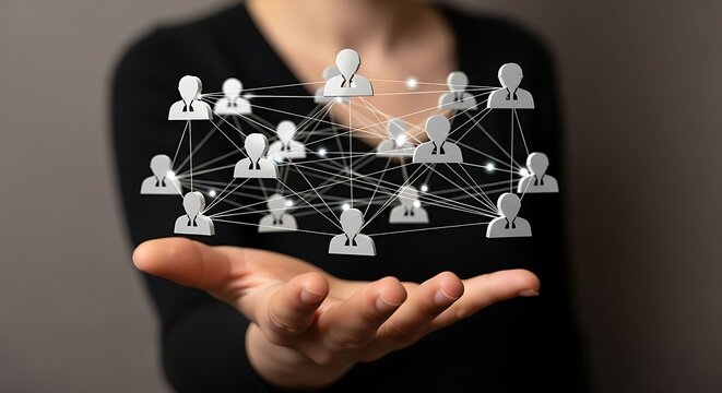 Person holding network of connected people icons in hand symbolizing social connections and community