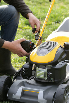 Pouring Oil Into Lawn Mower and Checking Oil Level &ndash; Small Engine Maintenance Close Up - Countryside Living and Outdoor Chores Lifestyle