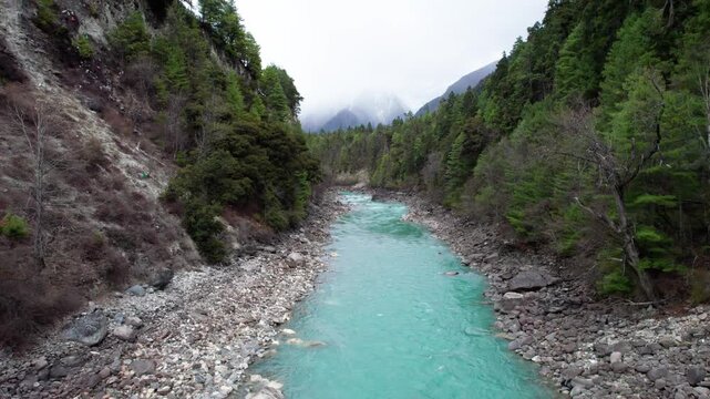 Drone view Parlung Zangbo river running along G318 or China National Highway 318 between Bomi and Baxoi County, Tibet, China, beautiful turquoise water in valley, 4k real time footage travel concept.