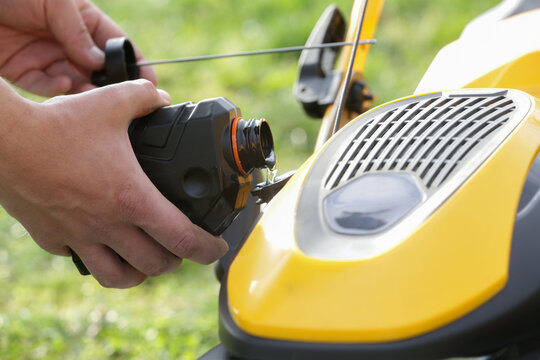 Pouring Oil Into Lawn Mower and Checking Oil Level &ndash; Small Engine Maintenance Close Up - Countryside Living and Outdoor Chores Lifestyle