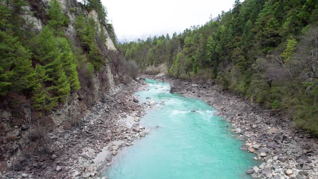 Drone view Parlung Zangbo river running along G318 or China National Highway 318 between Bomi and Baxoi County, Tibet, China, beautiful turquoise water in valley, 4k real time footage travel concept.