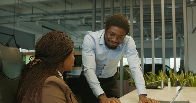 Professional advising while seated at computer in casual setting