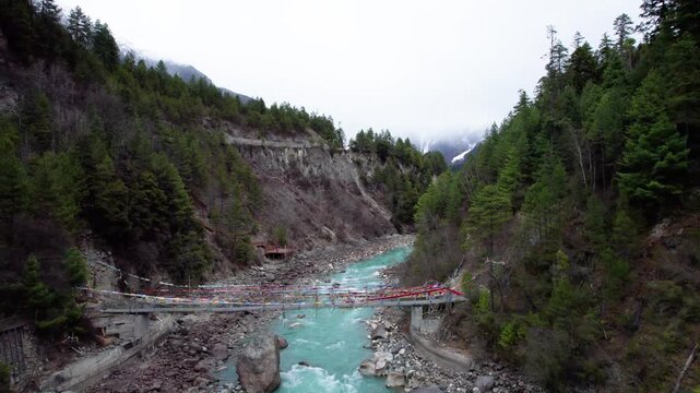 Drone view Parlung Zangbo river running along G318 or China National Highway 318 between Bomi and Baxoi County, Tibet, China, beautiful turquoise water in valley, 4k real time footage travel concept.
