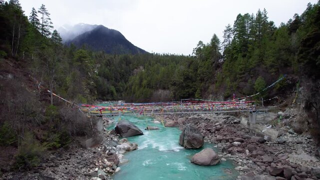 Drone view Parlung Zangbo river running along G318 or China National Highway 318 between Bomi and Baxoi County, Tibet, China, beautiful turquoise water in valley, 4k real time footage travel concept.