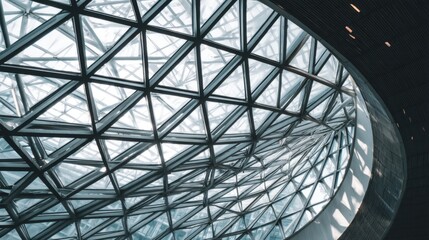 Fototapeta premium Modern architectural design featuring intricate glass structure with triangular patterns and natural light accents in urban environment