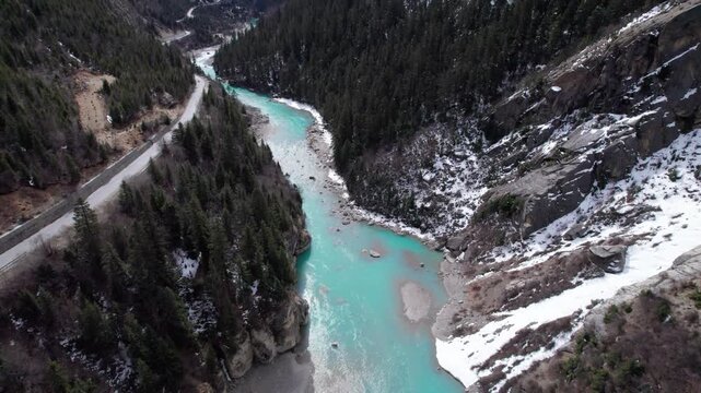 Drone view Parlung Zangbo river running along G318 or China National Highway 318 between Bomi and Baxoi County, Tibet, China, beautiful turquoise water in valley, 4k real time footage travel concept.