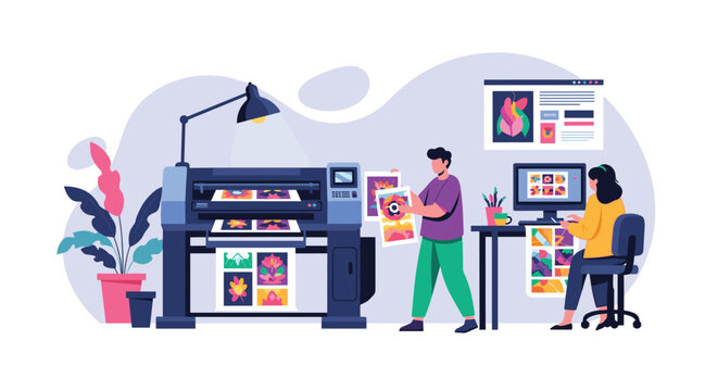 Graphic designers working in a professional printing studio with large format plotters and computers to produce high quality color prints.