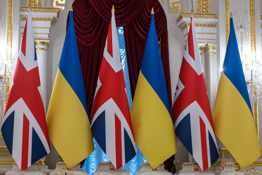 National flags of Ukraine and the United Kingdom displayed ahead of an official diplomatic meeting in Kyiv, Ukraine