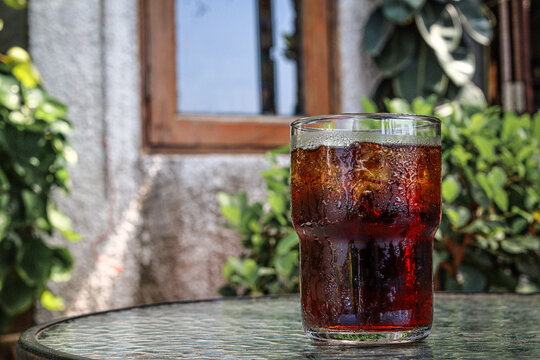 Cola drink with ice cubes