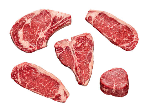 Collection of raw premium beef cuts including ribeye, New York strip, T-bone, and filet mignon.