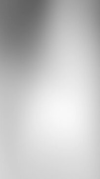A calming abstract background featuring a smooth gray silver gradient with subtle variations in light tones.	

