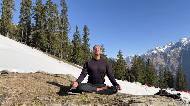 serene yoga practice in cold environment with natural scenic backdrop