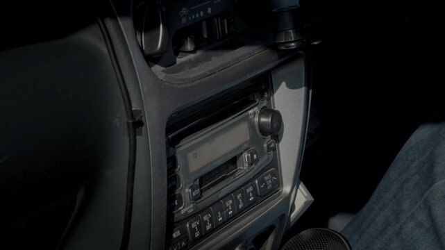 Inserting a CD into the Factory-Installed Head Unit Mounted on the Dashboard of the Retro Car and Starting to Play Music  |  Japan