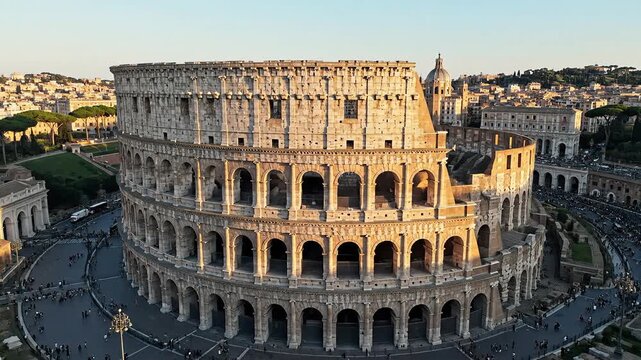 Iconic Colosseum in Rome Italy bathed in golden sunlight.
