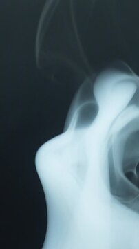Vertical Video of Smoke on Black Background 09