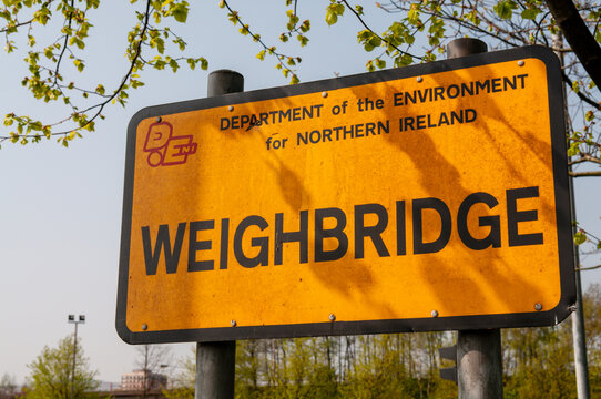 An official Department for the Environment metal roadside sign in County Down, Northern Ireland, marking a weighbridge station used for the regulatory weight enforcement of heavy goods vehicles.