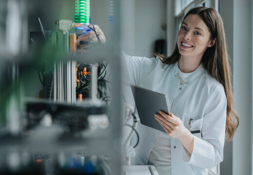 Scientist working with sorting machine and taking measurements in laboratory