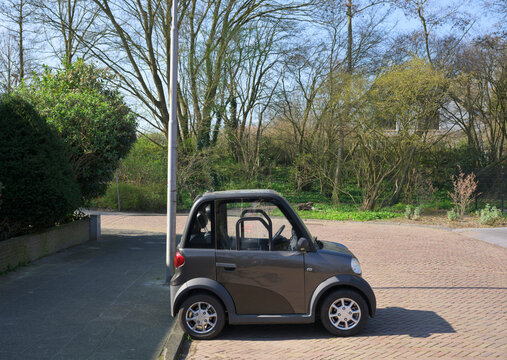 Small electric car parked sideways in Amstelveen Netherlands