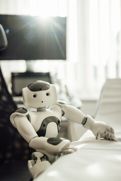 Humanoid robot in modern hospital room representing medical AI