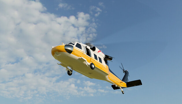 Yellow rescue helicopter flying in the blue sky during the day