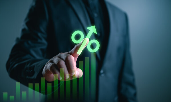 Businessman touching virtual growth chart with rising arrow and percentage symbol, representing financial growth, profit increase, investment return and business performance in digital economy concept