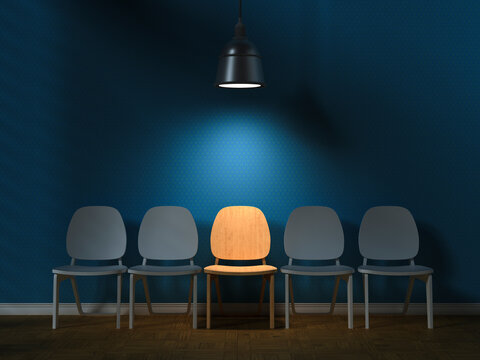 Illuminated chair among grey ones symbolizing individuality