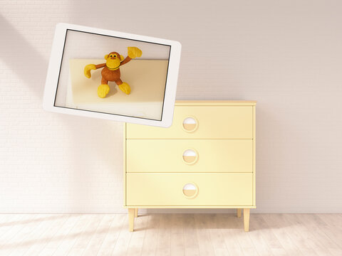 Floating digital tablet with toy monkey in modern children's room