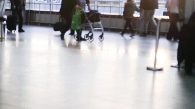 A mobility aid for an elderly person with joint pain in a public place using a wheeled device