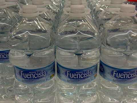 Palmanova, Spain, April 28, 2026, Row of large plastic bottles showing fuencisla natural spring water, representing hydration, healthy lifestyle, and consumer product availability in a supermarket