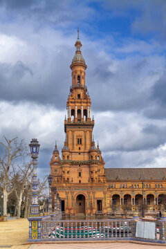 North Tower of Plaza de Espana in Seville, Spain, vertical view. Traditional baroque architecture, soft cloudy sky
