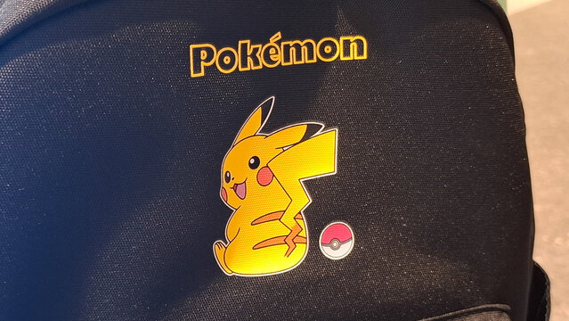 Pokemon Pikachu character design on black fabric backpack with embroidered logo on April 18, 2026 in Bangkok, Thailand