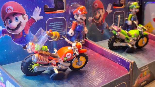 Super Mario Brothers and Luigi toy vehicles and figures from the movie collection on retail store display shelf on April 18, 2026 in Bangkok, Thailand