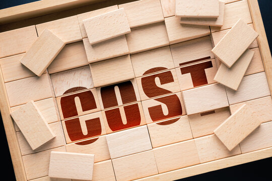 Hidden Cost Concept with Wooden Blocks Structure Revealing Underlying Expense