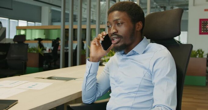 Office environment with focused individual making sales presentation