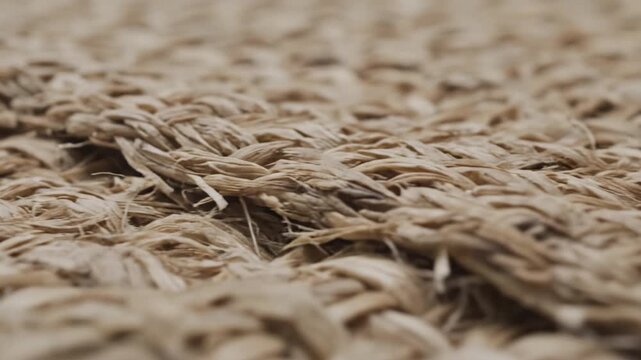 Woven fiber texture closeup natural material pattern beige color rough surface organic fabric detail macro photography natural fiber rope texture intertwined strands creating rustic tactile surface