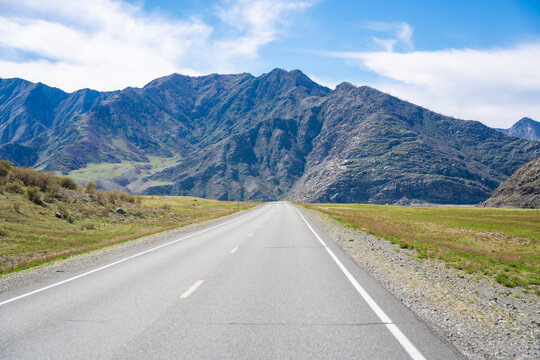 Road of Chuysky Trakt running along Katun River Altai Russia. Scenic route following Siberian mountain river through natural landscape.