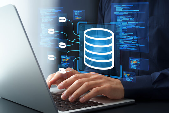 Data engineering. Development of data architecture and data pipelines. Programming and source code. Engineer designing data warehouse on laptop computer.