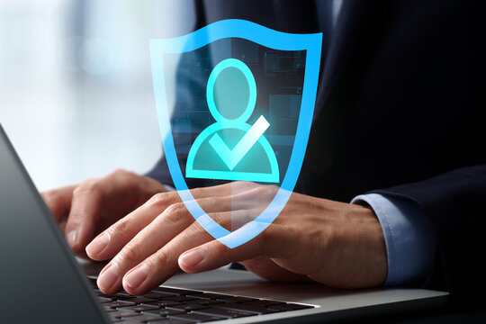 Authentication and identity verification security. Secure access control system. Businessman using ID management system on laptop computer.